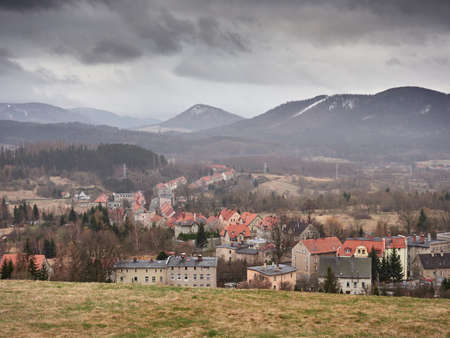 Skyline of the picturesquely situated town of Boguszow-Gorce in Poland with the Dzikowiec Mountain in the background.の写真素材