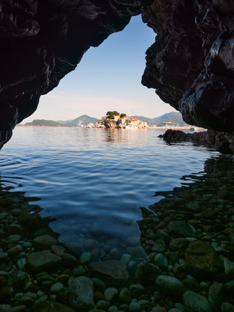 Sveti Stefan Island seen from the sea cave. Budva Riviera in Montenegro. Vertical viewのeditorial素材