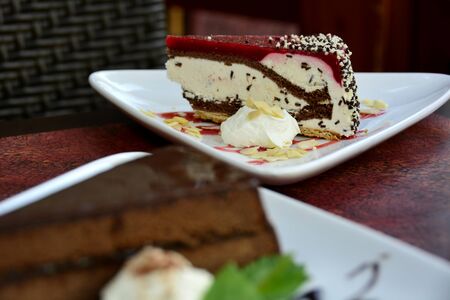 Restaurant food with fresh ingredients - vanilla cheescake with whipped cream and fruit top