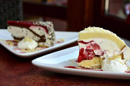 Restaurant food with fresh ingredients - vanilla cake with whipped cream and fruit insideの写真素材