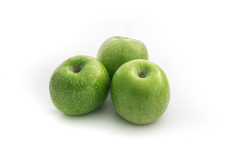 Green apples isolated on white backgroundの写真素材