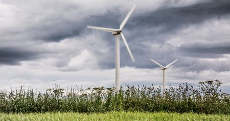 Wind farms in Scotland - wind turbines provide electricity (green energy) for households in UKの写真素材