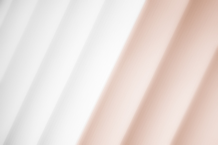 Elegant striped bronze background pattern fading into white spaceの写真素材