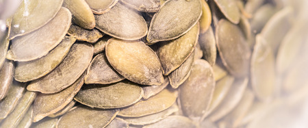 Pumpkin seeds isolated on white backgroundの写真素材