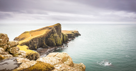 Isle of Skye landscape - Neist Point lighthouse, rocky cliffs, Atlantic Oceanの写真素材