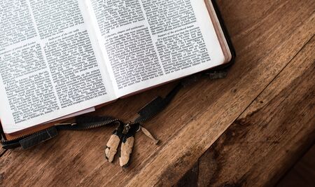 Holy Bible isolated on old vintage wooden tableの写真素材