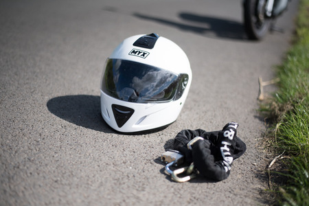 Stirling, Scotland - 15 August 2019: white helmet with motorbike in the backgroundのeditorial素材