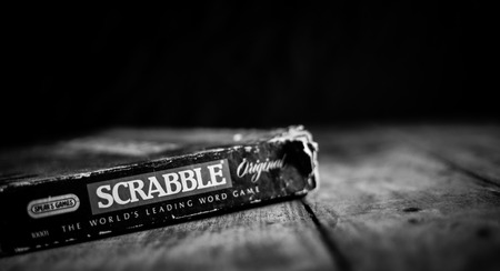 Perth, Scotland - 31 October 2019: Scrabble Board Game | Old Scrabble Box on Vintage Wooden Table |...