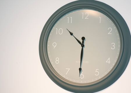 Big olive green wall clock with New York lettering on itの写真素材