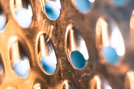 Shiny metal new grater isolated on blurred background