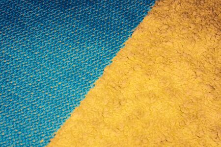 Orange blue color jumper clothing fabric texture sports wear background, close up