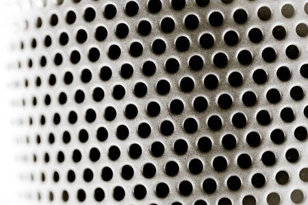 Black and white perforated steel plate for background, Iron perforated sheet metalの写真素材