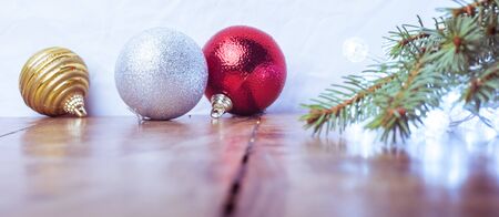 Merry Christmas and Happy New Year - Christmas Tree decorations on wooden floor