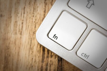 Computer keyboard - silver keyboard of a laptop with button Fn isolated. Home office with portable modern technology, IT and computing.の写真素材