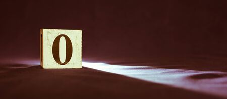 Rustic wooden block with number 0 - zero - dark backgroundの写真素材