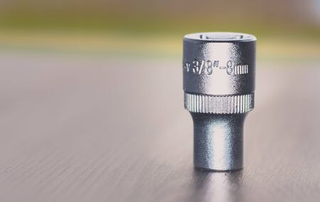 3/8 Socket Wrench isolated on blurry background - 8 mm Socket Wrench
