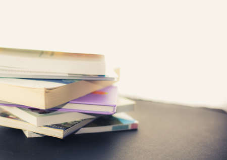 Stack of old books on plain backgroundの写真素材