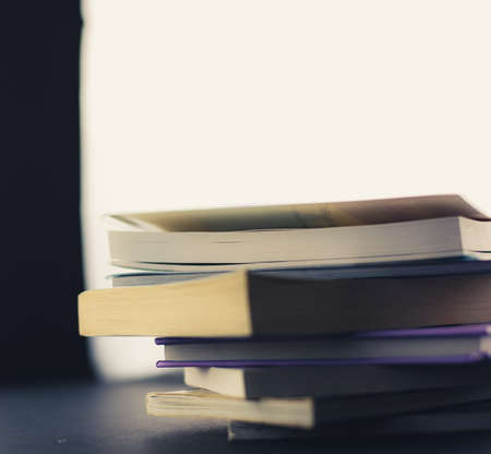Close up of pile of books on a table