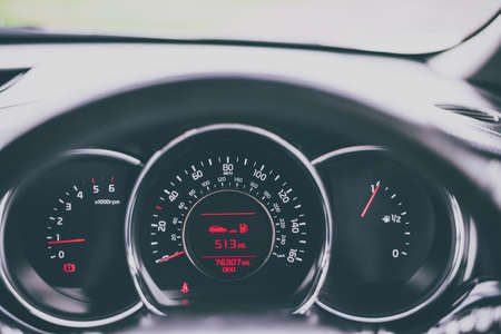 Instruments and information on a dashboard of a car - driver's perspectiveの写真素材