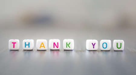 Thank you words on colourful blocks on bokeh background - appreciationの写真素材