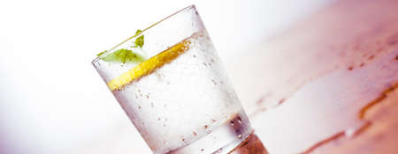 Lemonade with fresh lemon on wooden backgroundの写真素材