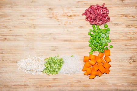 Homemade Dog Food Ingredients - mince, carrots, peas, rice, lentils, oatsの写真素材
