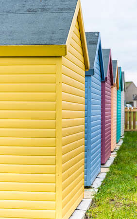 Amble, Northumberland, UK - February 2017: Colourful huts (yellow, blue, pink, green) located close to the beachのeditorial素材