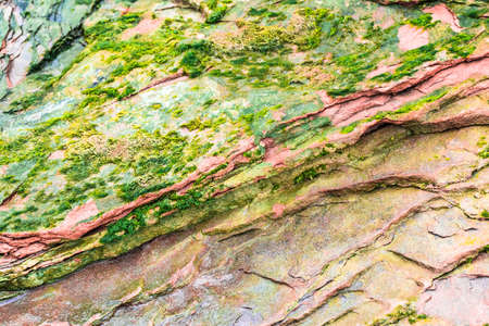 Colourful sedimentary rocks formed by the accumulation of sediments â natural rock layers backgrounds, patterns and textures - abstract graphic design â geology â nature formationsの写真素材
