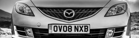 March 2015, Isle of Skye, Scotland: Mazda 6 estate GH - panoramic view - Black and White car photographyのeditorial素材