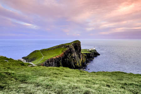 Colorful coastal sunset at Neist Point Lighthouse on Isle of Skye in Scotland, United Kingdomの写真素材