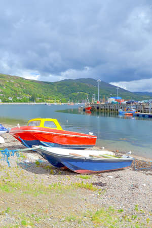 Fishing boats on a seashoreの写真素材