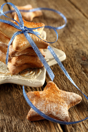 christmas homemade biscuits with blue ribbonの写真素材