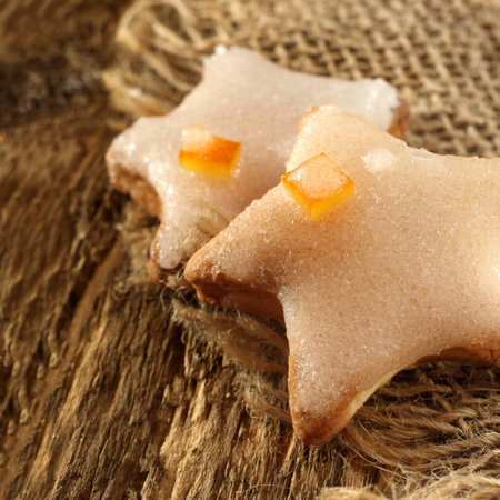 star shaped biscuit with icing and orange peelの写真素材