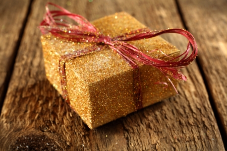 rustic plank with red and gold present boxの写真素材