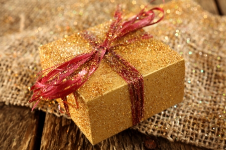 gold gift box on linen clothの写真素材