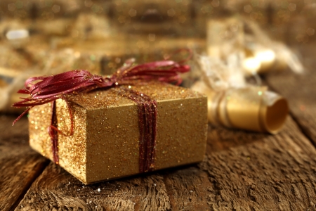 gold gift box on rustic plank tableの写真素材