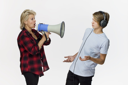 Generation gap. Male teenager not talking after an argumentの写真素材