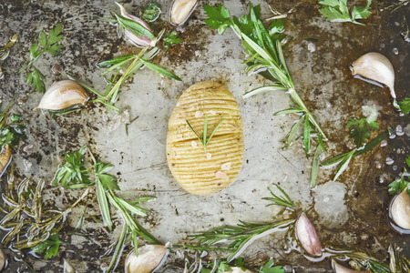 Homemade cheesy Hasselback potatoes. Vegetarian foodの写真素材