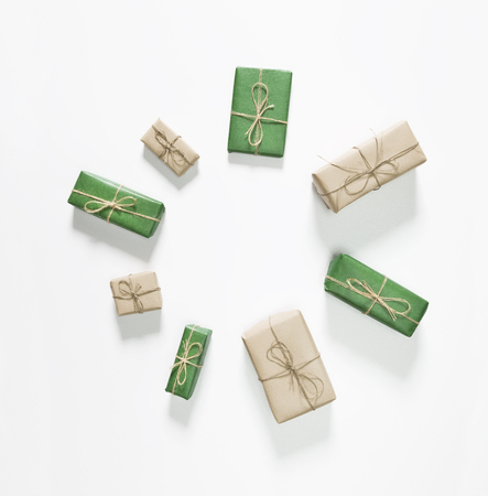 Christmas green and brown gift boxes on white background. Flat lay, top viewの写真素材