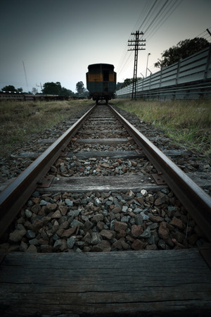 Cargo train platform at sunset with containerの写真素材