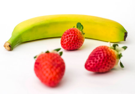 Banana with strawberriesの写真素材