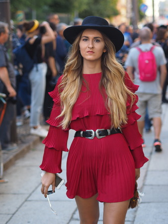 MILAN - SEPTEMBER 21: A fashionable woman walking before VIVETTA fashion show, during Milan Fashion Week spring / summer 2018 on September 21, 2017 in Milan.のeditorial素材