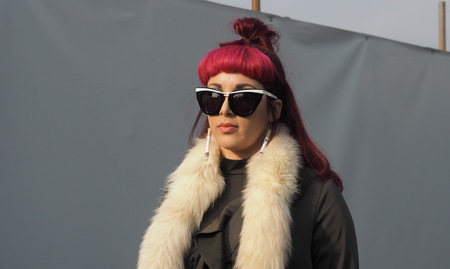 MILAN - JANUARY 14: Fashionable couple walking in the street before DSQUARED2 fashion show, during Milan Fashion Week Man fall / winter 2018/19 on January 14, 2018 in Milan.のeditorial素材