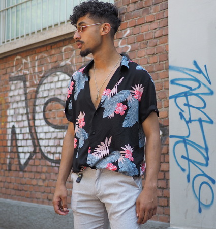 MILAN, ITALY -JUNE 18, 2018: Fashionable man posing for photographers in the street before FENDI...