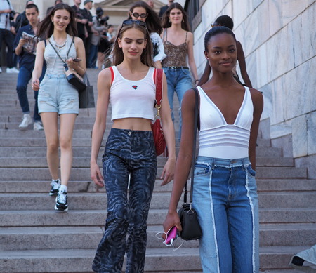 MILAN, ITALY -JUNE 15, 2018: Young models walking for photographers on Arengario stairs after ALBERTA FERRETTI fashion show, during Milan Fashion Week Men and women spring collections.のeditorial素材
