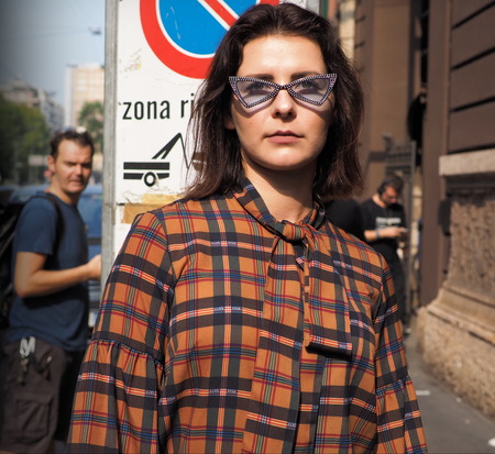 MILAN, Italy: 19 september 2018: Fashionable woman in the street style outfit before ANNAKIKI fashion show during Milan fashion week Fall winter 2018/2019.のeditorial素材