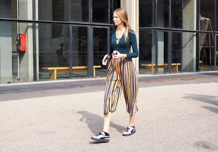 MILAN, Italy: 19 september 2018: Models and bloggers street style outfits after Alberto Zambelli fashion show during Milan fashion week Fall / winter 2018/2019.のeditorial素材