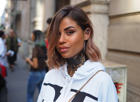 MILAN, Italy: September 21, 2018: Fashion blogger Zoe Cristofoli posing in street style outfit before ICEBERG fashion show during MFW fall / winterのeditorial素材