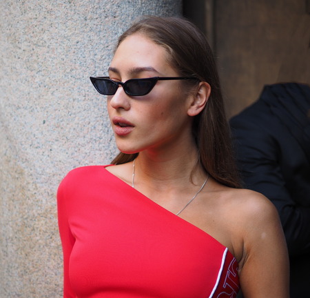 MILAN, Italy: September 21, 2018: Fashion blogger posing in the street style outfit before ICEBERG fashion show during MFW fall / winter 2018/2019.のeditorial素材