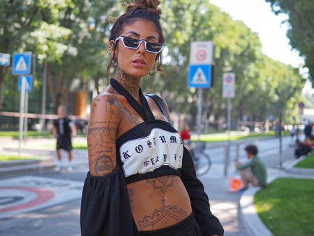 MILAN, Italy: 23 September 2018: Fashion blogger in different outfits before Armani Fashion show 2018 during Milan Fashion week fall winter 2018/2019.のeditorial素材